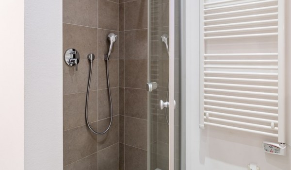 Walk-in shower in en suite bathroom in bedroom of a luxury family villa with private swimming pool and parking