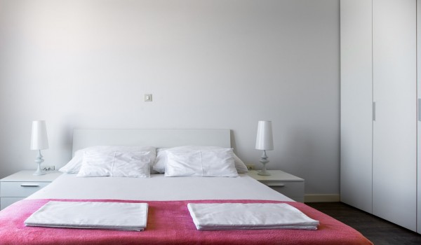 Double bed in a bedroom of a luxury vacation villa with family and friends in Ciovo with total privacy