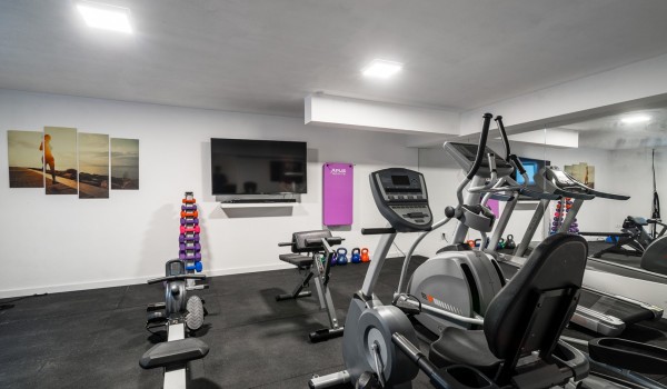 Various equipment in a private gym of a luxury vacation villa at the beach in Ciovo with total privacy