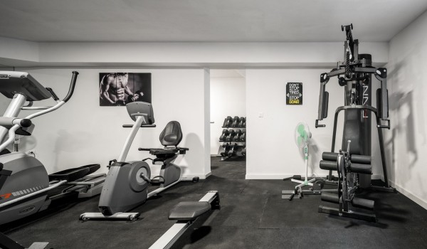 Private gym with various equipment in a luxury beachfront villa for vacation with friends in Ciovo