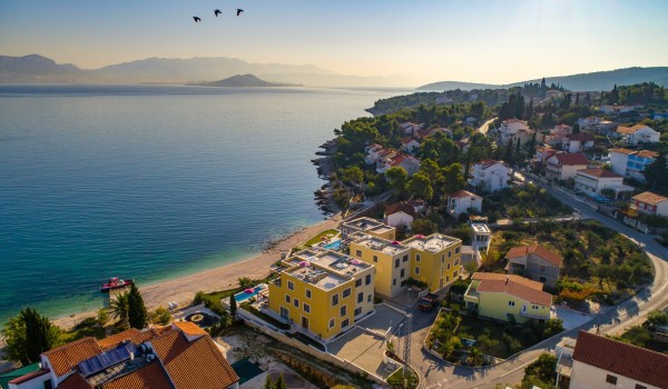 Aerial view of the bay and luxury beachfront villa Ciovo Joy 3 with private pool and gym in Ciovo with total privacy