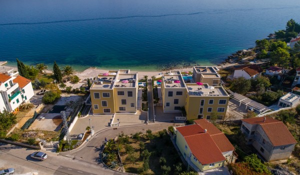 Aerial view of the bay and luxury beachfront villa Ciovo Joy 3 with private pool and gym in Ciovo