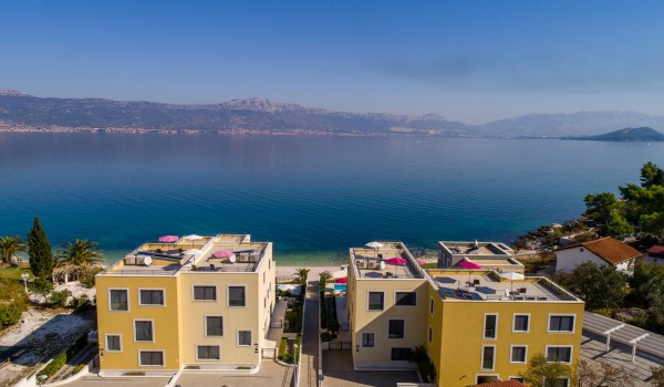 Aerial view of the bay and luxury beachfront villa Ciovo Joy 3 with private pool and gym in Ciovo