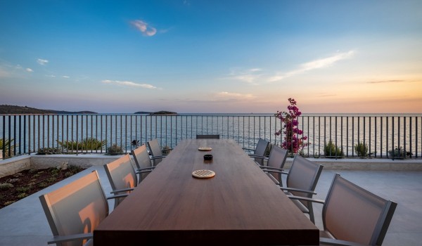 View of the sea from the dining table on the outdoor terrace of the luxury villa with private pool Supreme Rogoznica 2 in Rogoznica