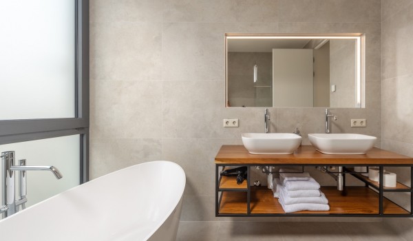 Bathroom equipped with bathtub, sink and mirror in luxury private holiday villa for rent Supreme Rogoznica 2 in Rogoznica