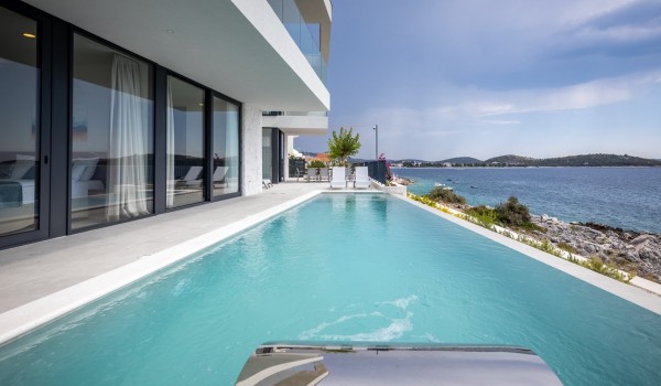 View of the private pool with a view of the sea in the Croatia luxury villa Supreme Rogoznica 2 in Rogoznica with total privacy