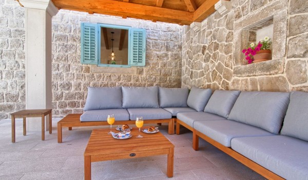 Seating area on the covered terrace of a Croatia luxury villa Cavtat Iliria with jacuzzi and a private parking near Dubrovnik