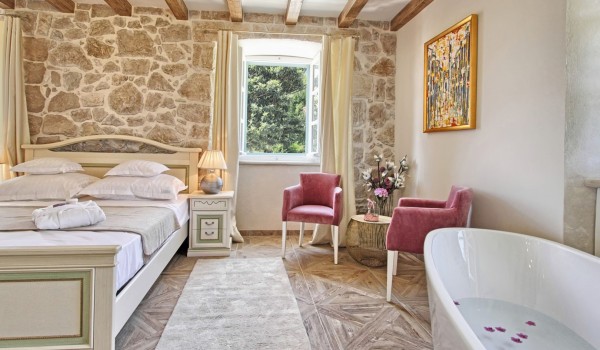 Luxurious air conditioned bedroom with a bathtub on a first floor of Croatian luxury home rental in Dubrovnik