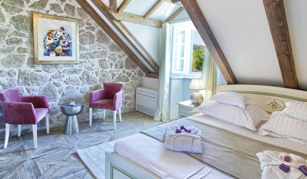 Air conditioned bedroom in the attic of the historic stone villa Cavtat Iliria for a family rent and vacation near Dubrovnik