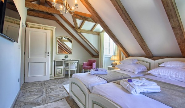 Air conditioned double bedroom in the attic of the historic stone villa Cavtat Iliria for vacations with friends and family near Dubrovnik