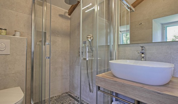 Luxurious bathroom with a shower in the attic of historic stone villa Cavtat Iliria for a family rent and vacation near Dubrovnik
