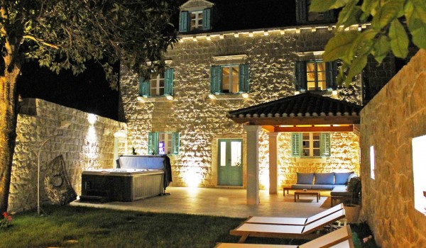 A view of the luxury holiday villa Cavtat with jacuzzi, private garden, outdoor shower and a stone gazebo near Dubrovnik
