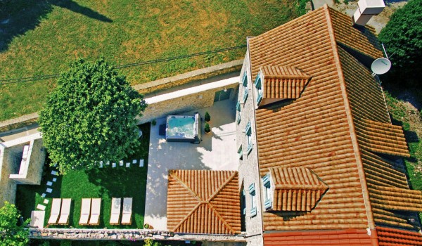 Aerial view of the fenced property of luxury Croatian villa Cavtat Iliria with jacuzzi, garden and total privacy