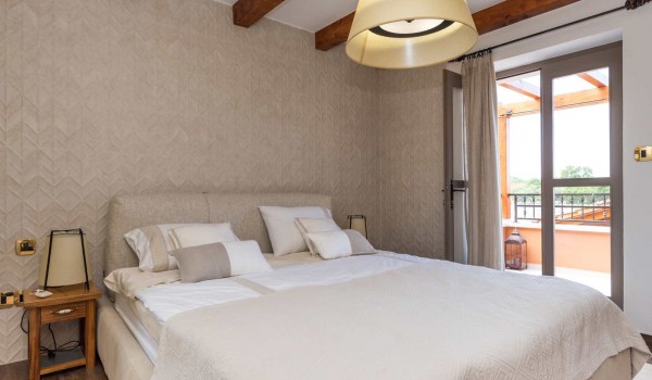 King size bed in a bedroom of a luxury pet-friendly villa for family vacation in Skradin with complete privacy
