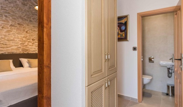 View of a king size bed in a bedroom of a luxury Croatian villa Finessa  Skradin 1 with private pool and sauna
