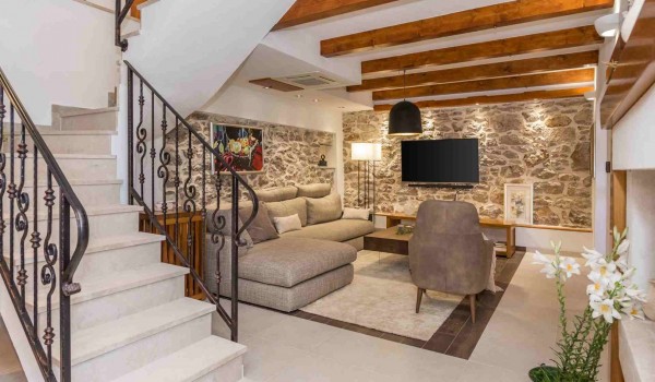 Living room with comfortable sofas on the ground floor of a luxury Croatian villa Finessa Skradin 1 with concierge service