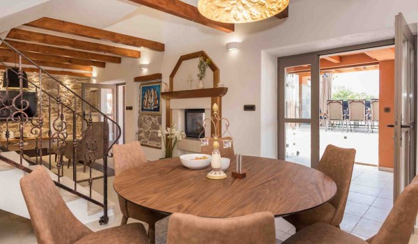 Dining table and chairs in the luxury Croatian villa for family vacation in Skradin