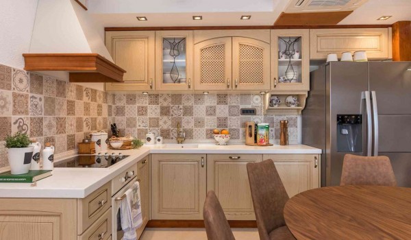 Fully equipped kitchen on a ground floor of a luxury holiday villa with concierge service and wifi