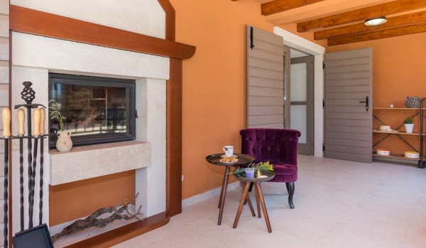 Seating area by the fireplace in a Croatian luxury vacation villa with concierge service and parking