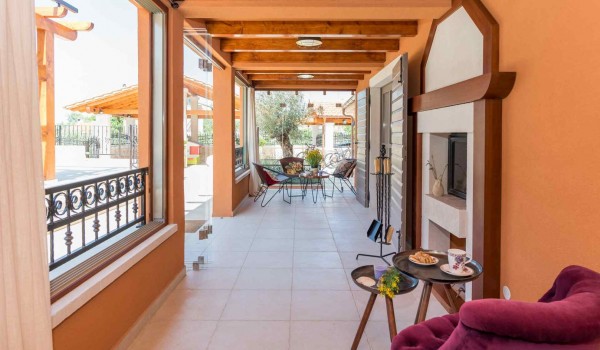 Seating area by the fireplace in a Croatian luxury vacation villa with concierge service and parking