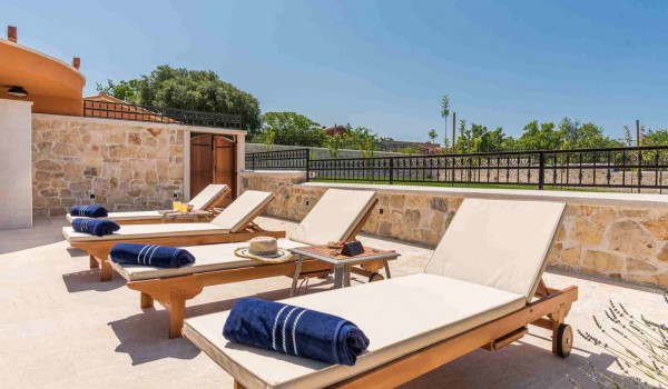 Sun loungers on the terrace of a luxury Croatian villa for family vacation with complete privacy