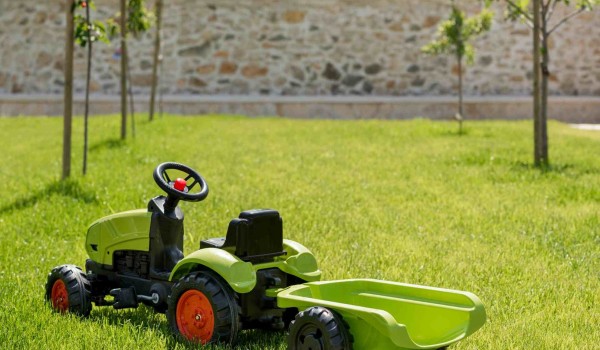 Toy tractor in a garden of a luxury pet-friendly villa for family vacation in Skradin