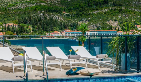 Private terrace of Croatia luxury family villa with pool and deckchairs for vacation and rent in Dubrovnik