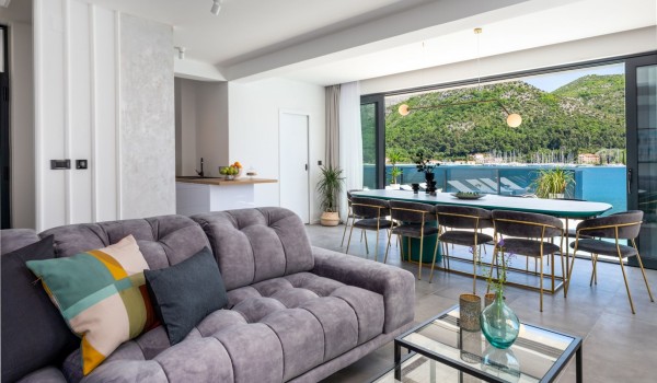 Living room area of Croatia luxury beachfront villa with modern design sofa and coffee table for rent
