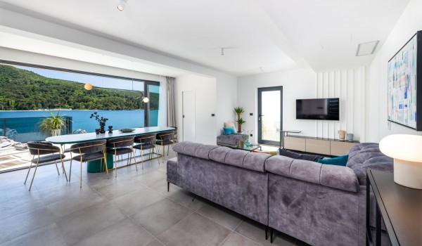Living room area of Croatia luxury pool villa with sofas and coffee table for vacation and rent with friends