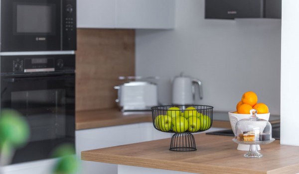 Fully equipped kitchen area of Croatia luxury pool villa with microwave and stove for family vacation
