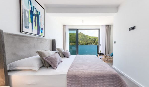 Bedroom of Croatia luxury pool villa with king-size bed and private balcony with sea view for rent