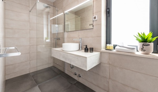 Luxury bathroom of Croatia luxury family villa with shower cabin and sink with mirror for vacation and rent