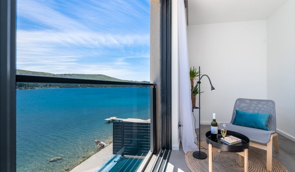 Lounge area in the bedroom of Croatia luxury pool villa with sea view for vacation and rent with friends