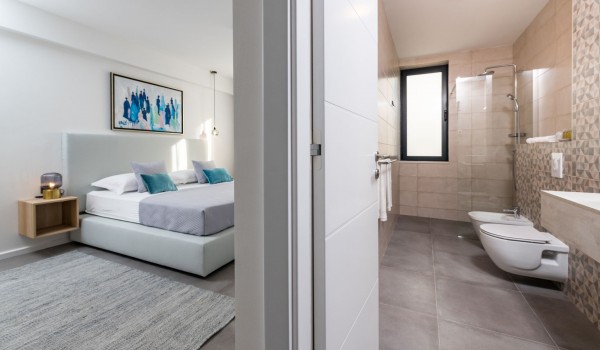 Bedroom of Croatia luxury holiday villa with king-size bed and private bathroom for rent with family