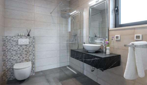 Modern designed bathroom of the luxury Dubrovnik pool villa with shower cabin and sink for rent