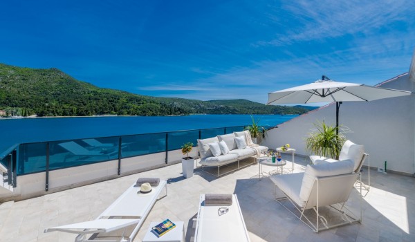 Private balcony of Croatia luxury sea view villa with deckchairs and sundeck for vacation and rent with family