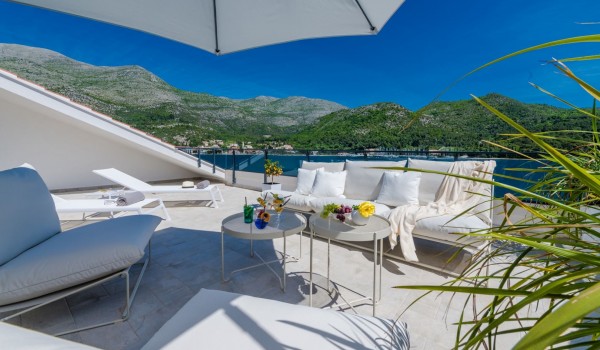 Private balcony of Croatia luxury sea view villa with deckchairs and sundeck for vacation and rent