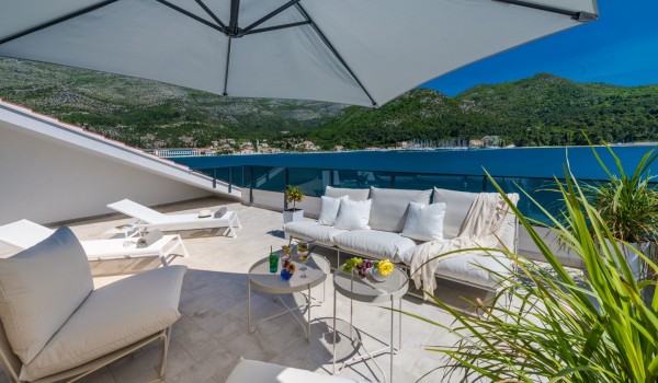Private balcony of Croatia luxury sea view villa with deckchairs and sundeck for vacation and rent