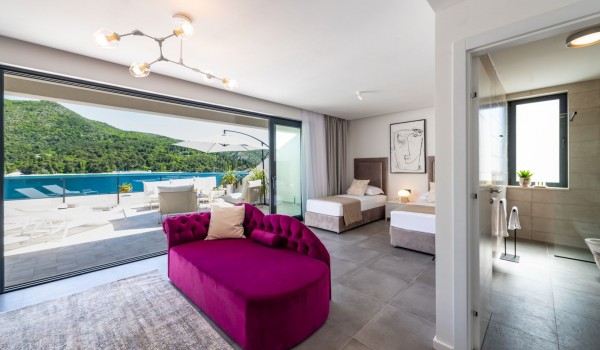 Bedroom of Croatia luxury family villa with two single beds and private bathroom for vacation and rent