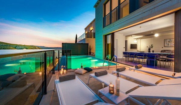 Private terrace of Croatia luxury family villa with pool and deckchairs perfect for relaxing with friends