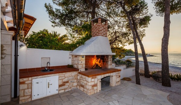 Outdoor grill on the terrace of the traditional beachfront villa with private parking on Brac island