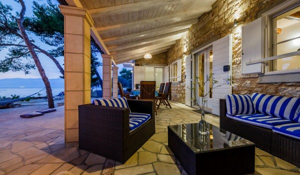 Seating area on the terrace of the Brac family house Summer Retreat on the beach