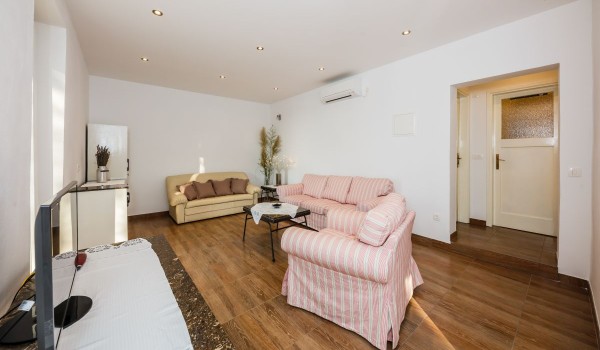 Charming living room with comfortable sofas in the beachfront family villa on Brac island with private parking