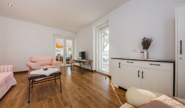 Charming living room with comfortable sofas in the beachfront family villa on Brac island with private parking