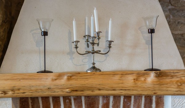 Candlesticks on the fireplace of the stone beachfront villa Summer Retreat on Brac island