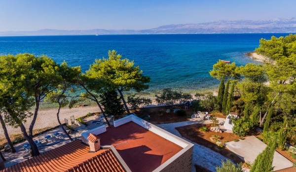 Aerial view of the beautiful bay and traditional stone house for family vacation