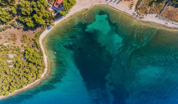Aerial view of the beautiful bay and traditional stone house for family vacation