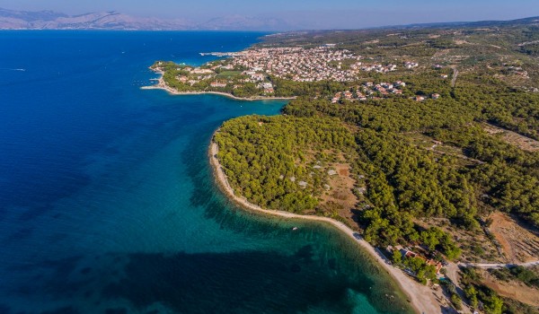 Aerial view of the beautiful bay and traditional stone house for family vacation