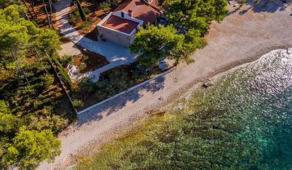 Aerial view of the beautiful bay and traditional stone house for family vacation