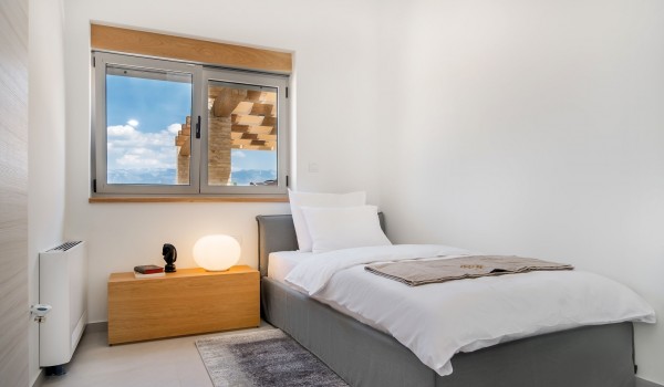 Modern air-conditioned bedroom with a bed for one person with WIFI in a luxury villa with a pool for rent by the sea and the beach Summer Dream Privacy Novalja on the island of Pag